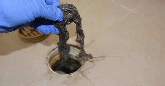 Clogged drain full of hair